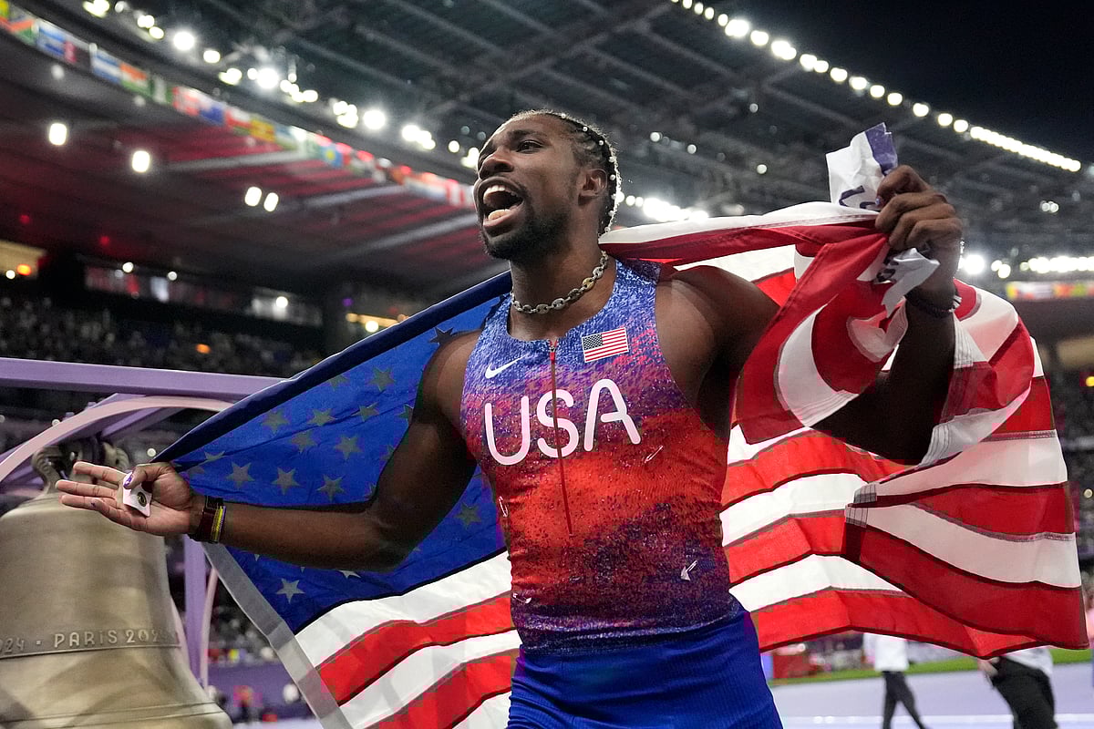  (AP Photo/Matthias Schrader) : Noah Lyles, of the United States, celebrates after winning the men's 100-meters final at the 2024 Summer Olympics, Sunday, Aug. 4, 2024, in Saint-Denis, France.